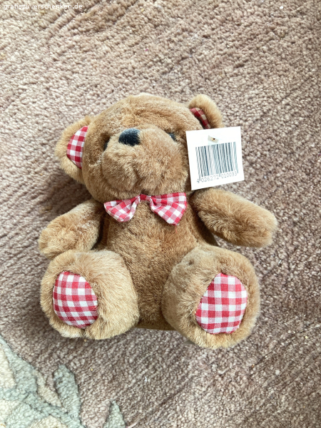 Teddybär mit karierter Schleife